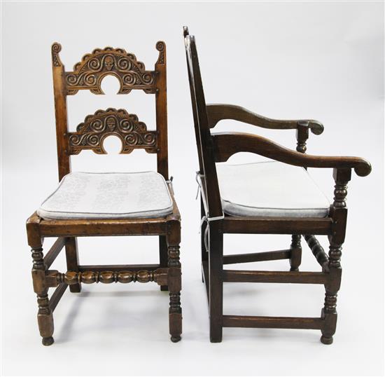 A set of eight 17th century style South Yorkshire carved oak dining chairs,